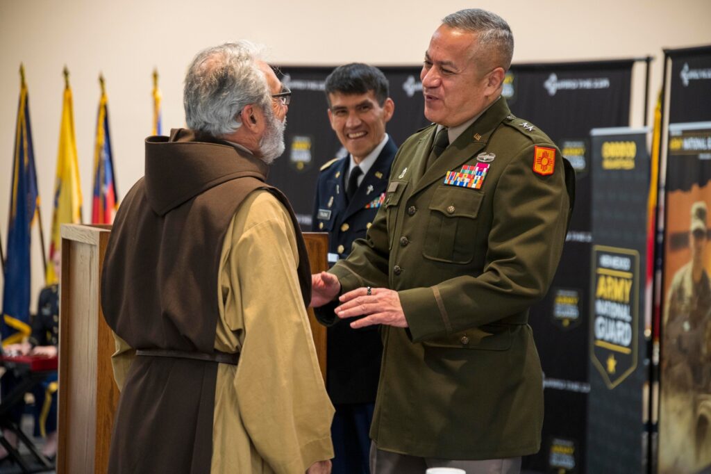 Maj. Gen. Miguel Aguilar and the Rev. Father Richard Iannucci share a moment before the prayer breakfast.